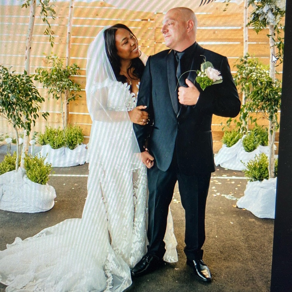 White Veil with white beaded trim. Medium and tiered length.